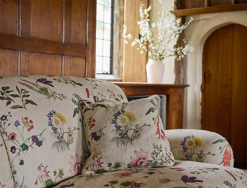 Kentwell 3 seater 2 hump sofa in Spill Resistant RHS Caroline Maria Applebee Collage Wildflowers detail